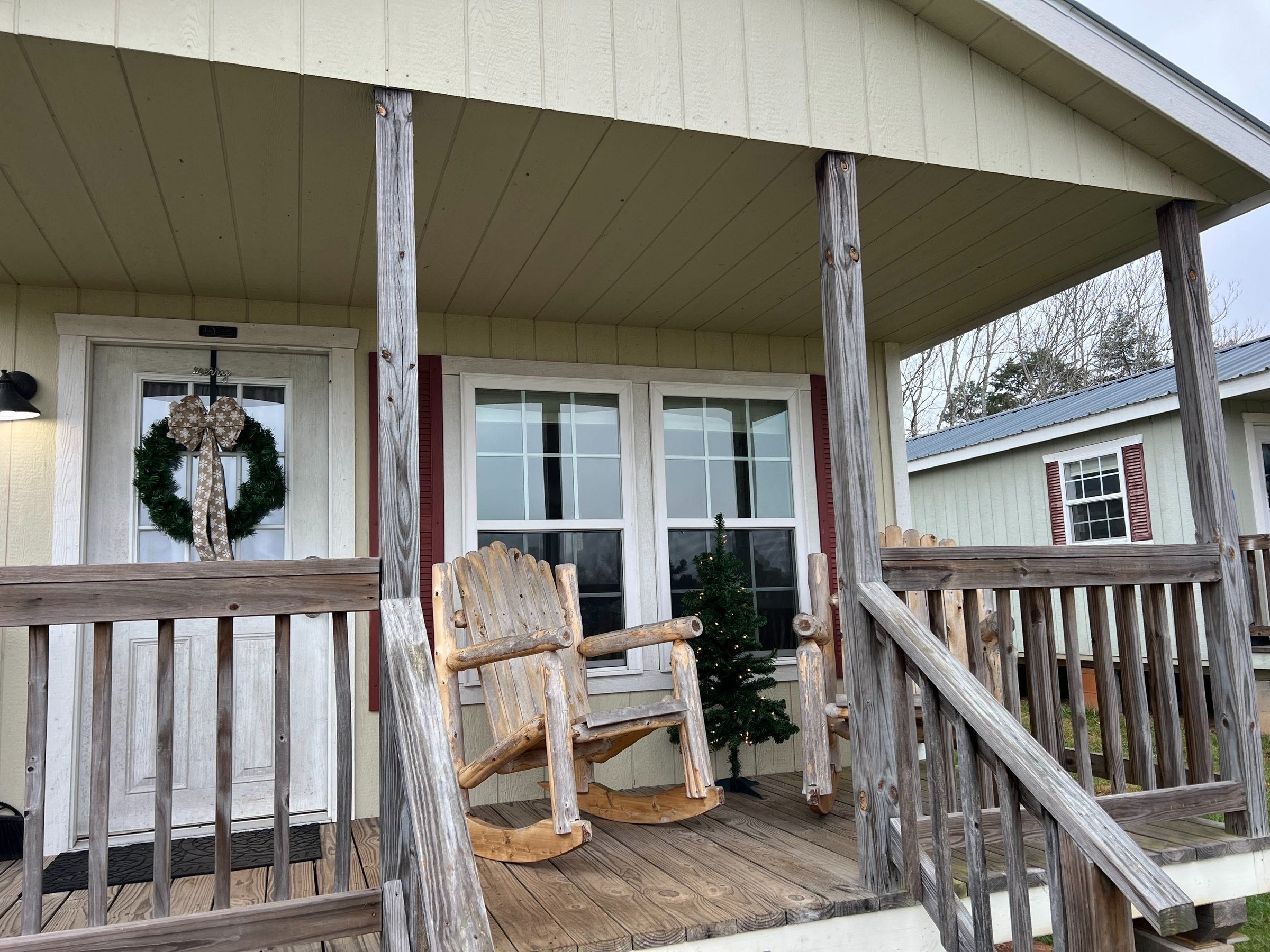 Cabin porch with rocking chairs at TerraStay Farm